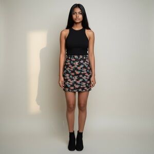 NWOT Milly skirt size 4. Black with pink/coral and aqua pattern.